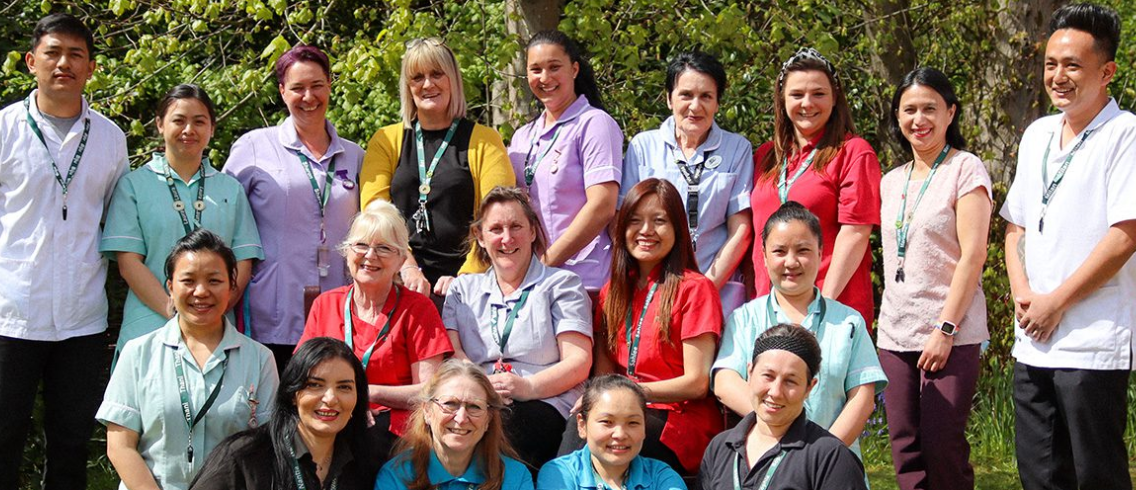 group of residents around fountain